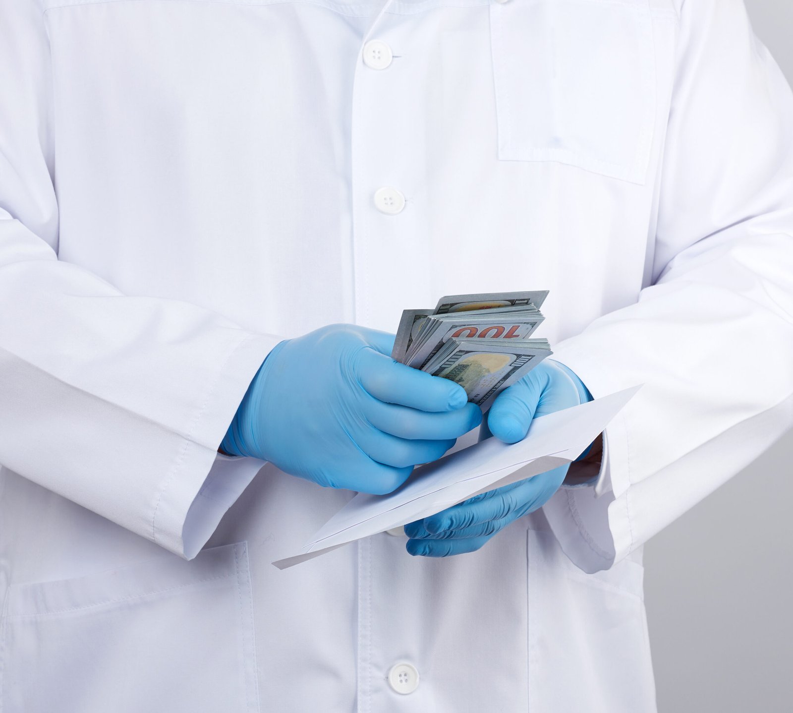 physician white coat wearing blue sterile gloves doctor holds pack paper money anti corruption concept scaled